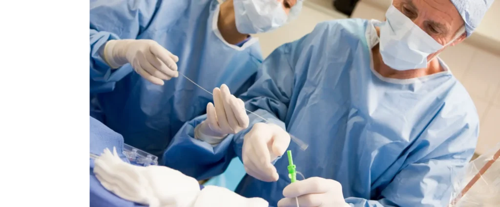 Physician looking at monitors in operating room