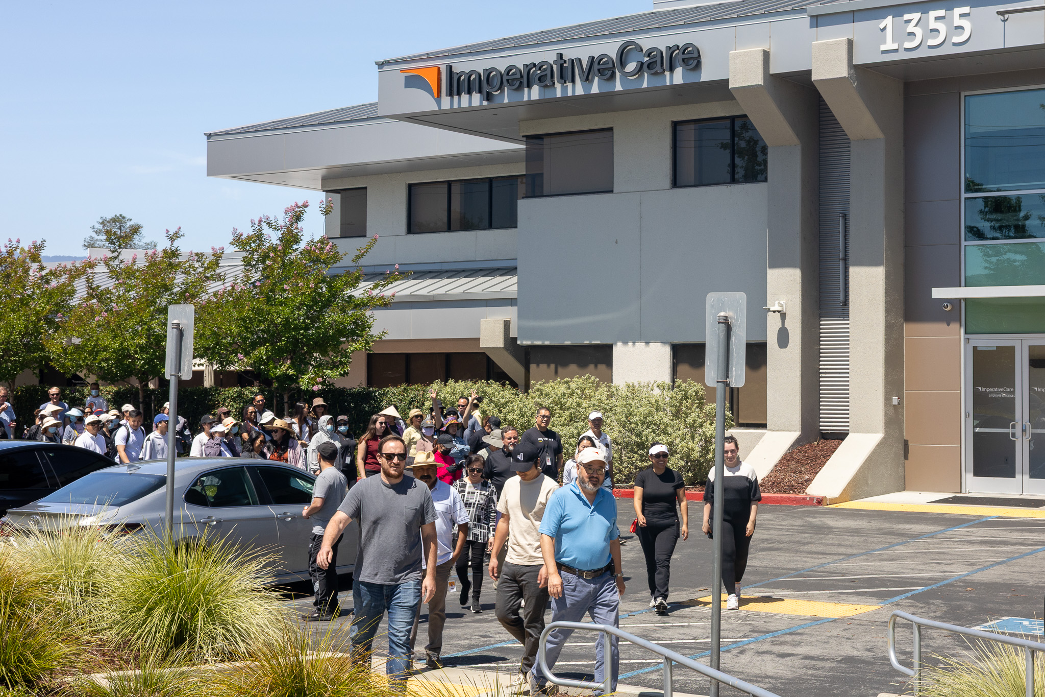 Imperative Care employees walking together outside the company’s building